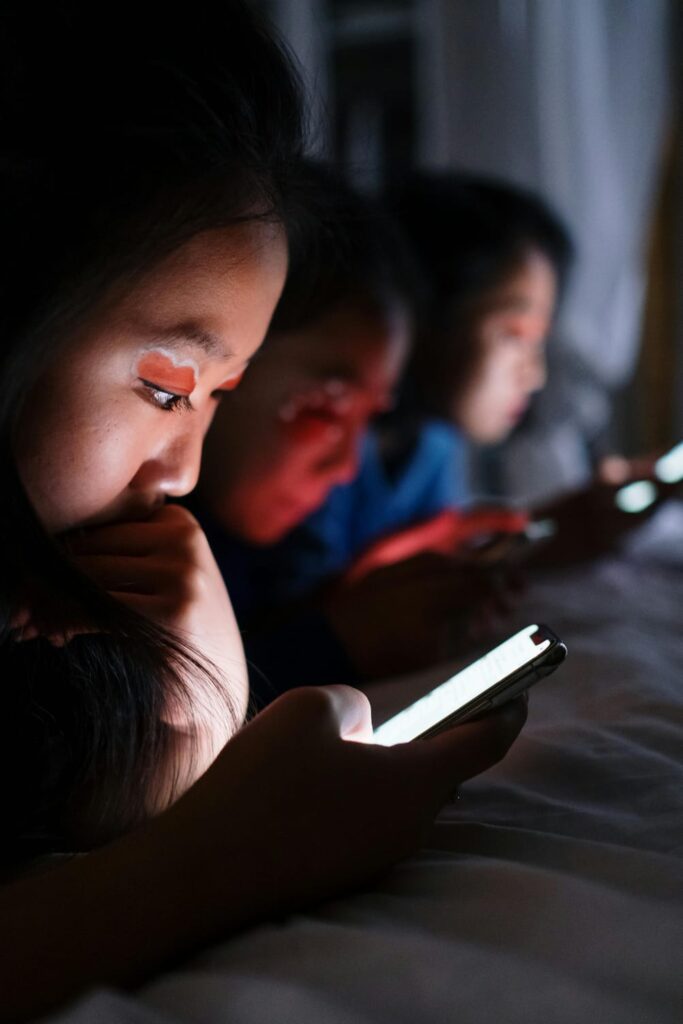 Indian teenager addicted to social media, scrolling phone late at night