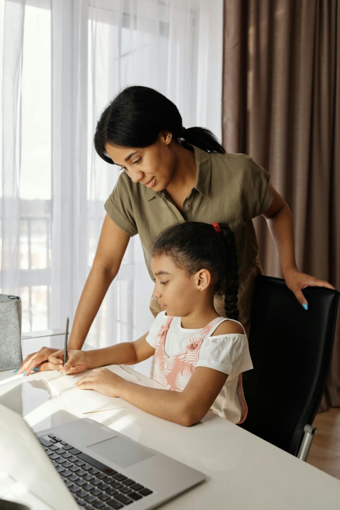 Student teaching online from home with headphones and laptop