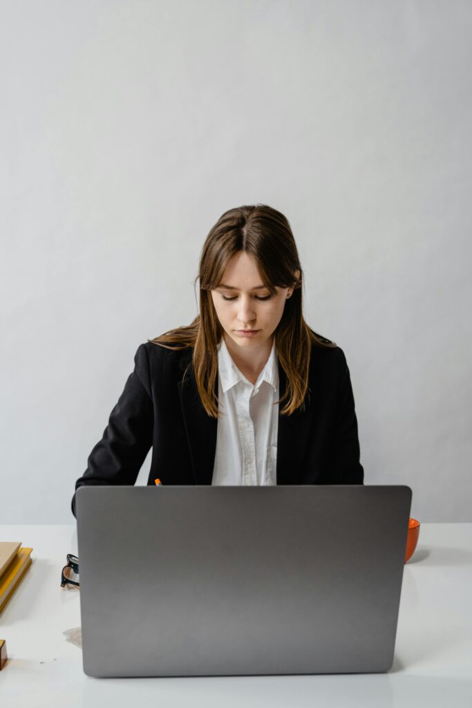 Student researching different career options on laptop