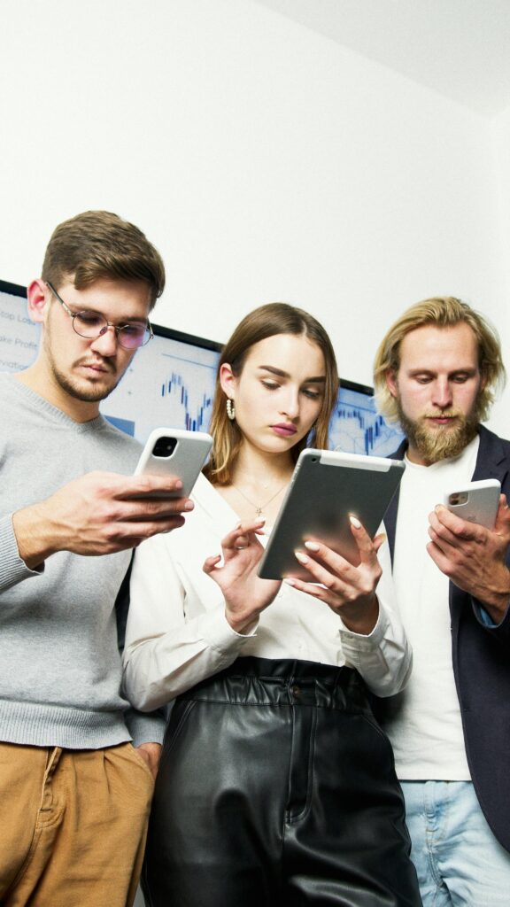 Young investor tracking market news on smartphone