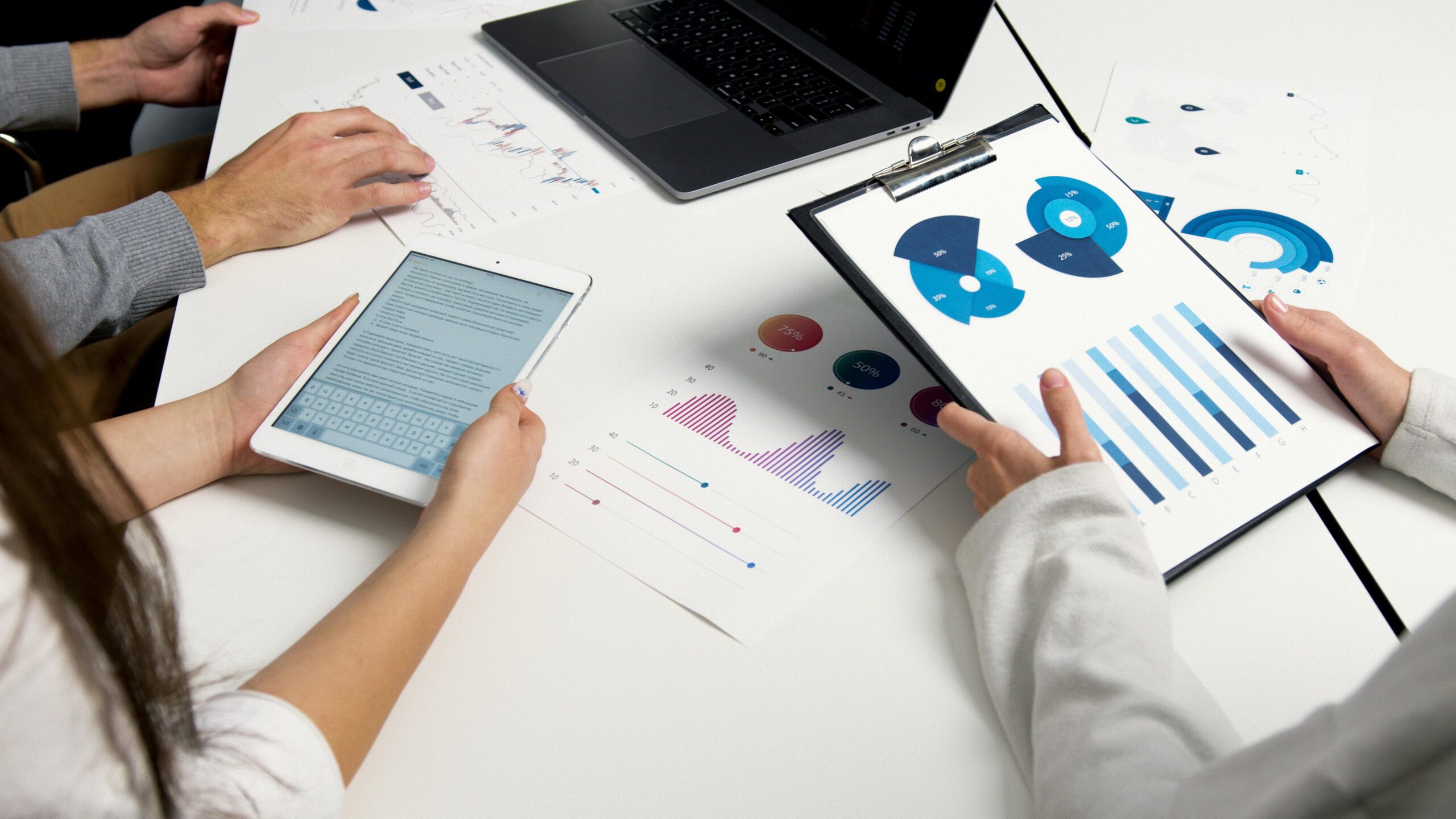 Business finances management concept with laptop and financial charts