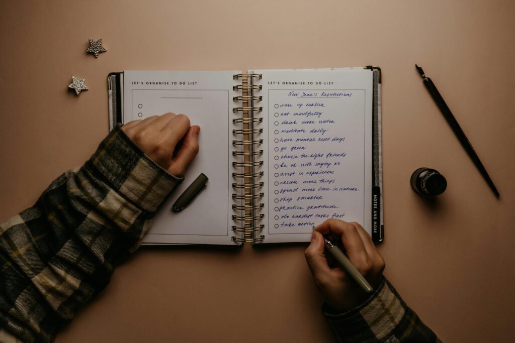 Writing small achievable goals to stay motivated during tough times