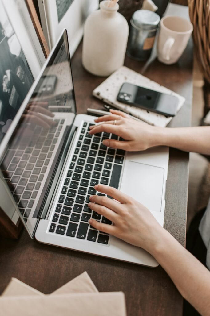 Student browsing scholarship websites on laptop